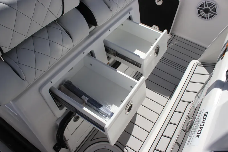 Slide: The Image of 2025 Sea Fox 288 Commander boat storage drawers with cushioned seating. - 29