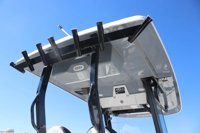 Slide: The Image of 2025 Sea Fox 288 Commander boat top view with rod holders against clear blue sky. - 31