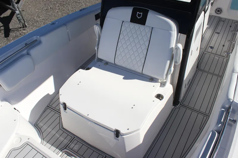 Slide: The Image of 2025 Sea Fox 288 Commander boat interior with cushioned seating and sleek design. - 8