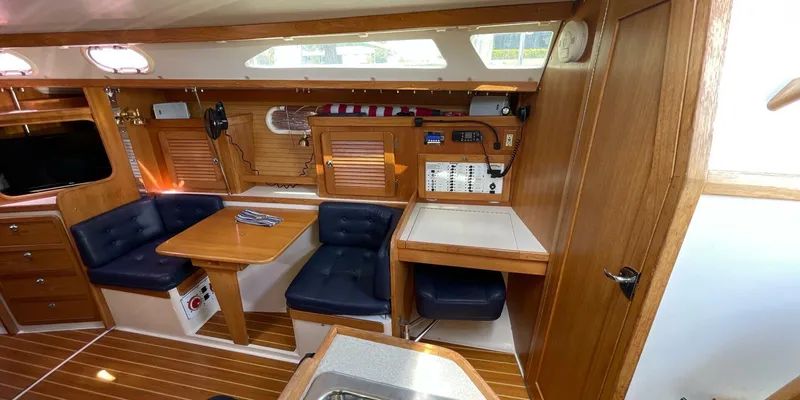 Slide: The Image of Interior of 2005 Catalina 350 MkII sailboat with wood finish and seating area. - 18
