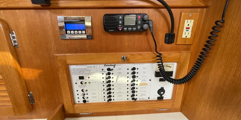 Slide: The Image of Control panel of a 2005 Catalina 350 MkII sailboat with radio and switches. - 19