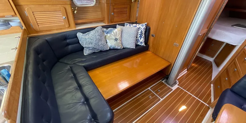 Slide: The Image of Interior of 2005 Catalina 350 MkII sailboat with plush seating and wooden finishes. - 20