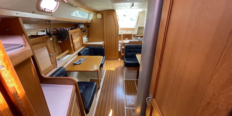 Slide: The Image of Interior of 2005 Catalina 350 MkII sailboat with wooden furnishings and seating area. - 23