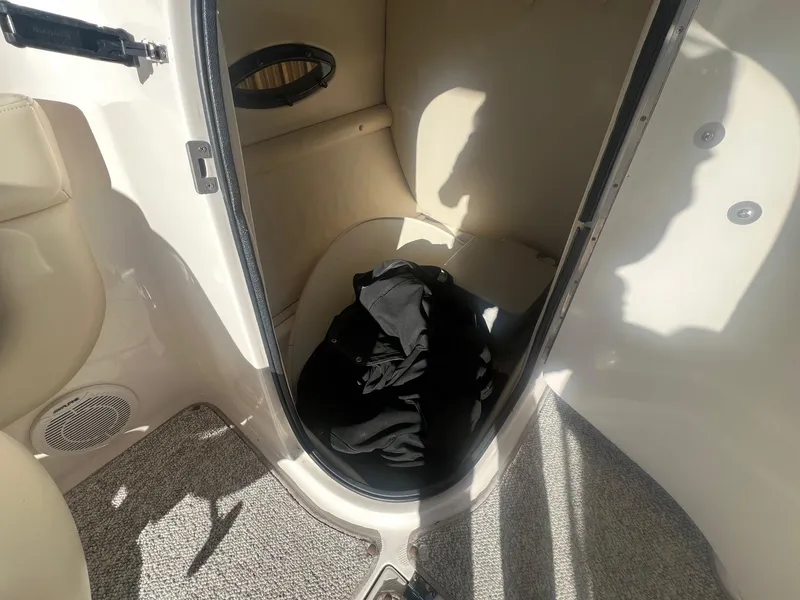 Slide: The Image of Interior cabin of 2002 Chaparral Sunesta 243 boat with carpeted floor. - 17