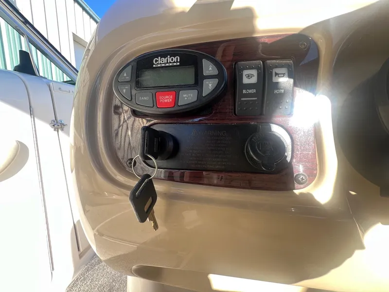 Slide: The Image of Close-up of 2002 Chaparral Sunesta 243 dashboard with Clarion stereo and ignition key. - 22