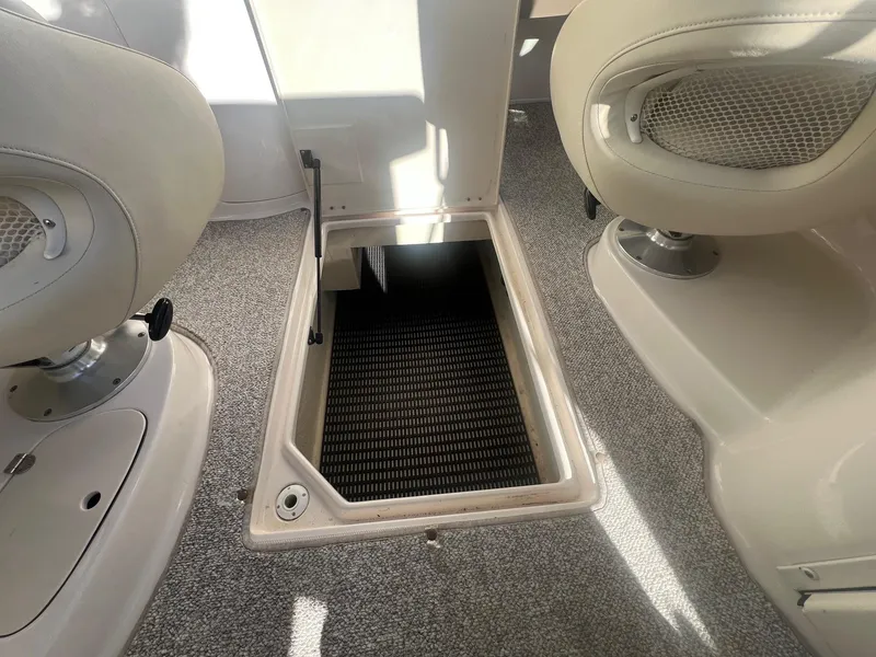 Slide: The Image of Open storage compartment on 2002 Chaparral Sunesta 243 boat interior. - 30