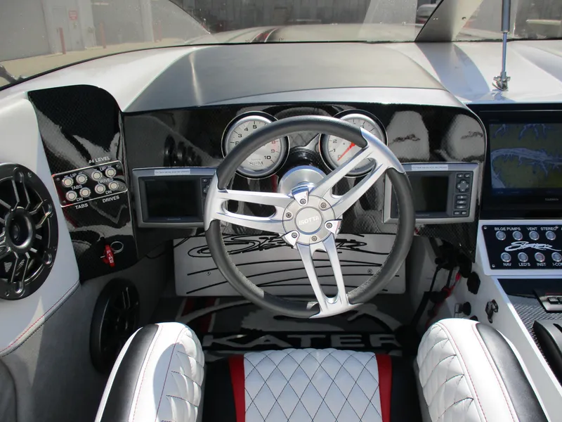 Slide: The Image of Skater 482 boat dashboard, 2012 model, featuring sleek steering wheel and modern controls. - 12