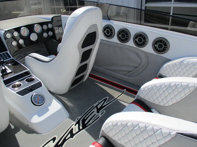 Slide: The Image of Luxurious Skater 482 boat interior, 2012 model, featuring white quilted seats and modern dashboard. - 16