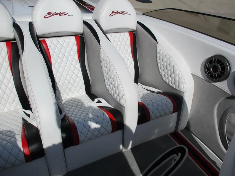 Slide: The Image of Luxurious Skater 482 boat interior with quilted seats, red accents, and sleek design, 2012 model. - 19