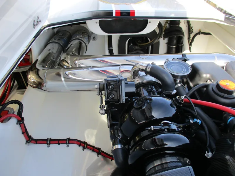 Slide: The Image of Engine compartment of a 2012 Skater 482 boat, showcasing intricate mechanical components. - 23