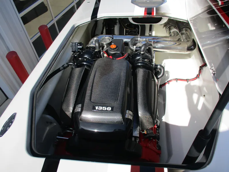 Slide: The Image of High-performance engine in 2012 Skater 482 boat, featuring carbon fiber components. - 25