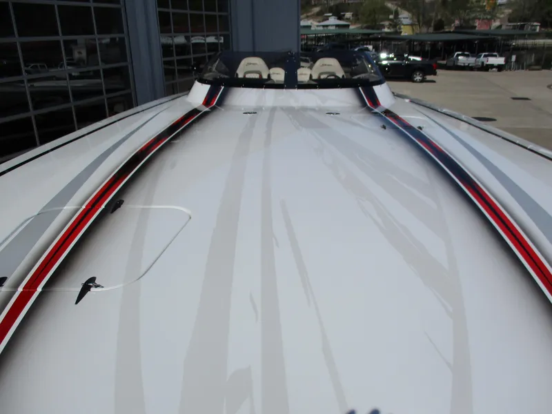 Slide: The Image of 2012 Skater 482 boat with sleek design and red accents. - 4