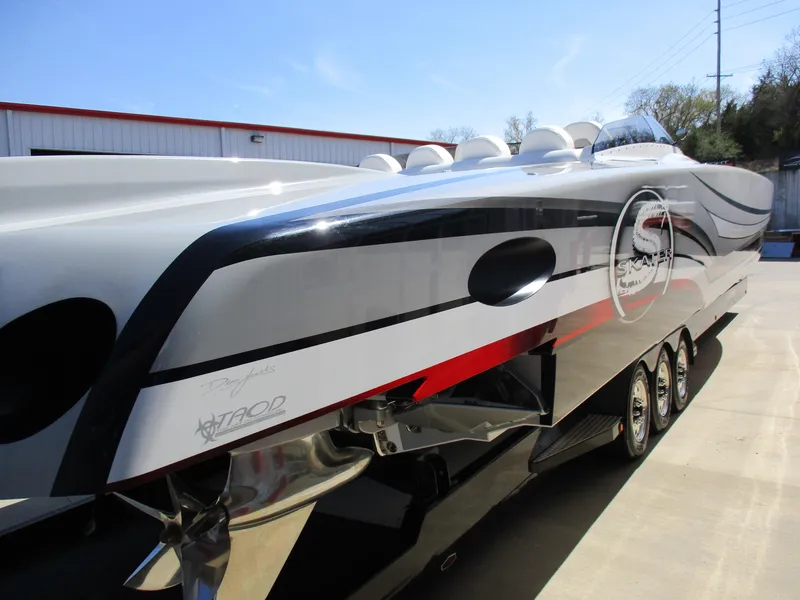 Slide: The Image of 2012 Skater 482 speedboat with sleek design and vibrant graphics. - 6