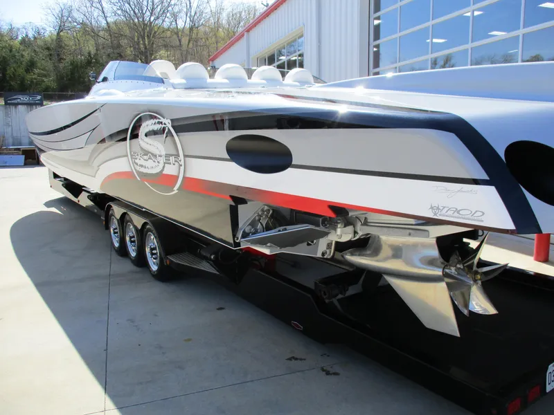 Slide: The Image of High-performance Skater 482 speedboat, 2012 model, with sleek design and triple-axle trailer. - 7
