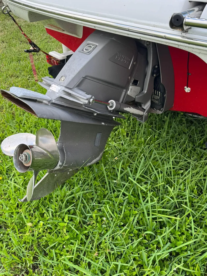 Slide: The Image of 2010 Crownline 195SS boat propeller and stern drive on grass. - 14
