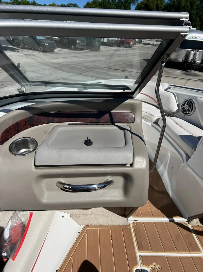 Slide: The Image of 2010 Crownline 195SS boat interior with windshield and seating area. - 20