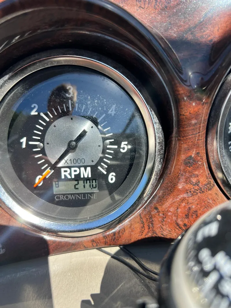 Slide: The Image of Close-up of 2010 Crownline 195SS RPM gauge showing 2100 RPM. - 21