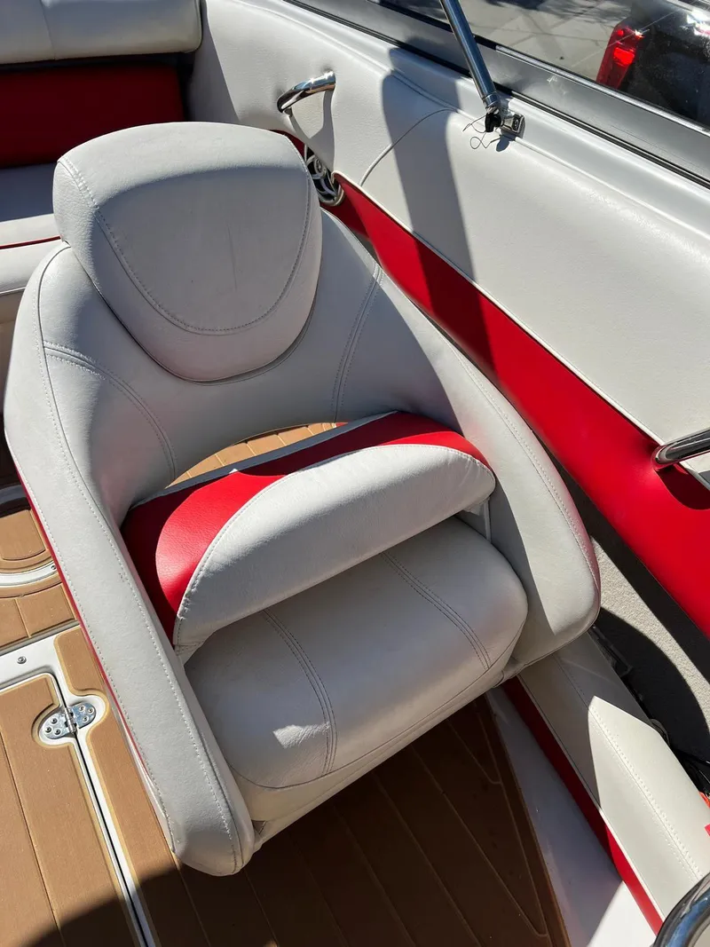 Slide: The Image of 2010 Crownline 195SS boat interior with red and white seating. - 23