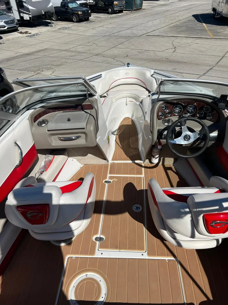 Slide: The Image of Interior of a 2010 Crownline 195SS boat with red and white seating. - 24
