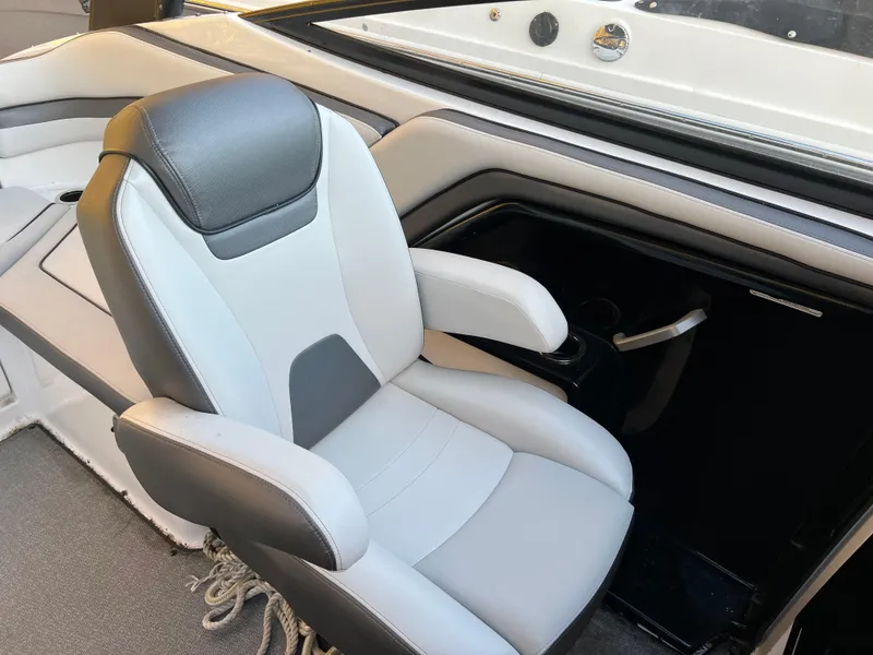 Slide: The Image of 2020 Yamaha AR240 boat interior with a sleek, modern captain's chair. - 6