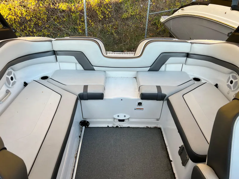 Slide: The Image of 2020 Yamaha Boats AR240 interior seating with gray upholstery and modern design. - 7