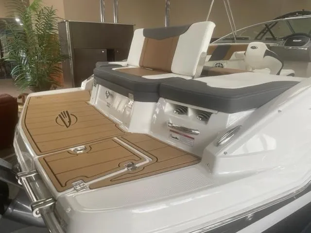Slide: The Image of 2024 Chaparral 23 SSi boat with stylish seating and deck design. - 8