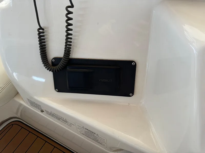 Slide: The Image of 2001 Silverton 410 Sport Bridge interior with radio panel and coiled cord. - 39