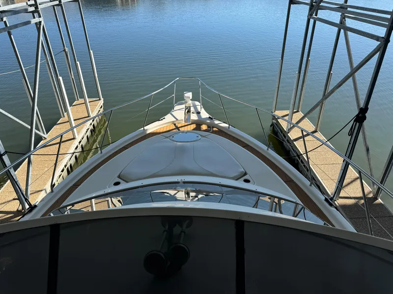 Slide: The Image of 2001 Silverton 410 Sport Bridge docked at marina, viewed from above. - 40