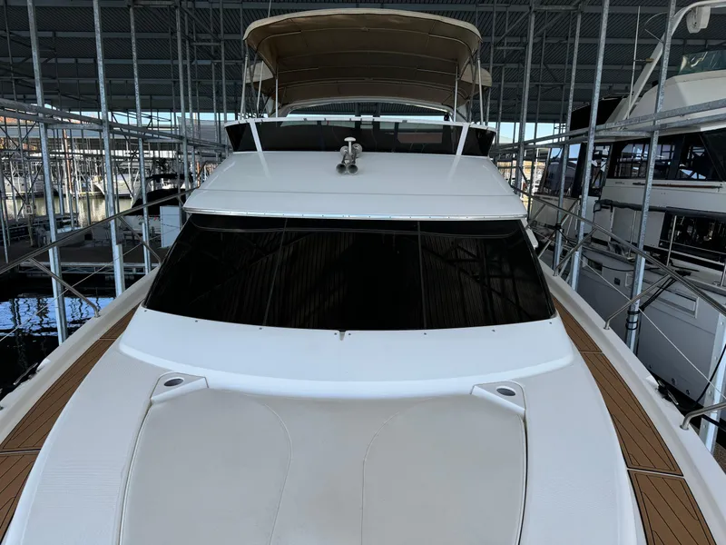 Slide: The Image of 2001 Silverton 410 Sport Bridge yacht docked in a marina. - 45