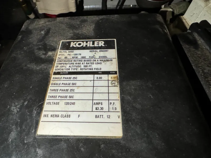 Slide: The Image of Kohler generator label on 2001 Silverton 410 Sport Bridge, showing specifications and voltage details. - 49