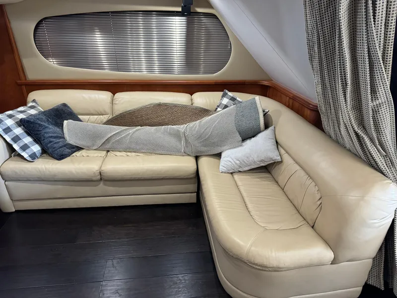 Slide: The Image of Luxurious interior of 2001 Silverton 410 Sport Bridge with beige leather seating and cushions. - 7