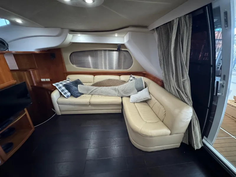 Slide: The Image of Luxurious interior of 2001 Silverton 410 Sport Bridge yacht with leather seating. - 8