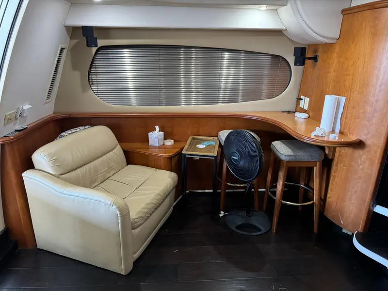 Slide: The Image of Interior of 2001 Silverton 410 Sport Bridge with leather seating and wooden accents. - 9