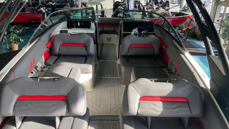 Slide: The Image of 2025 Regal LS4 boat interior with gray and red seating, modern design. - 2