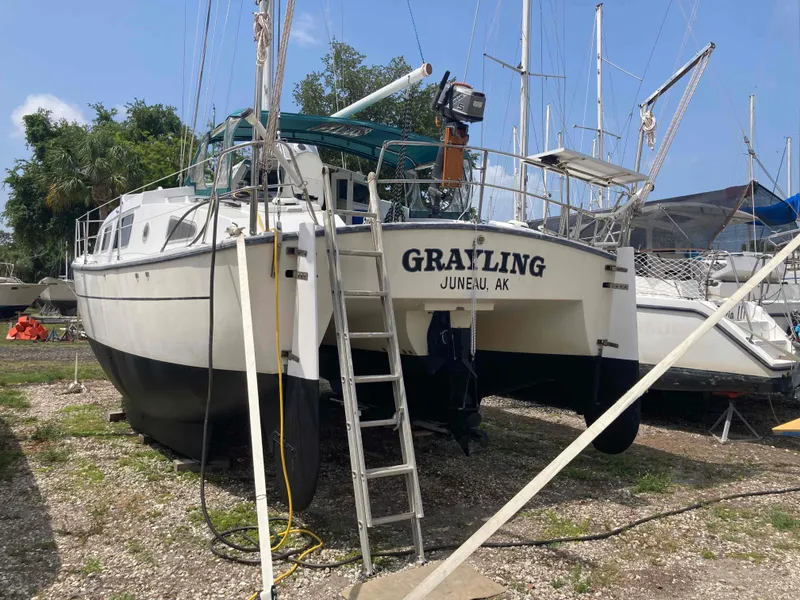 Slide: The Image of 1979 Catamaran Ocean Winds 33 named Grayling, docked on land in Juneau, AK. - 2