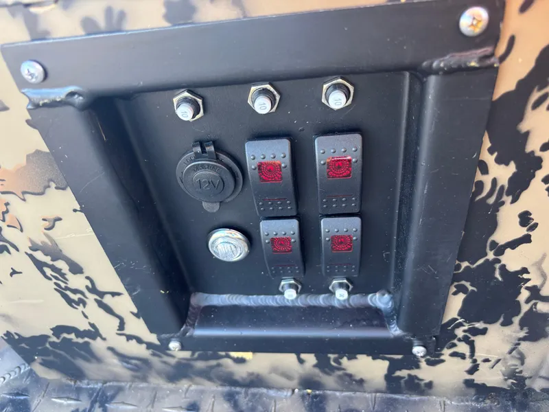 Slide: The Image of Control panel of 2025 Edge Duck Boats 556 DB with switches and outlets. - 10