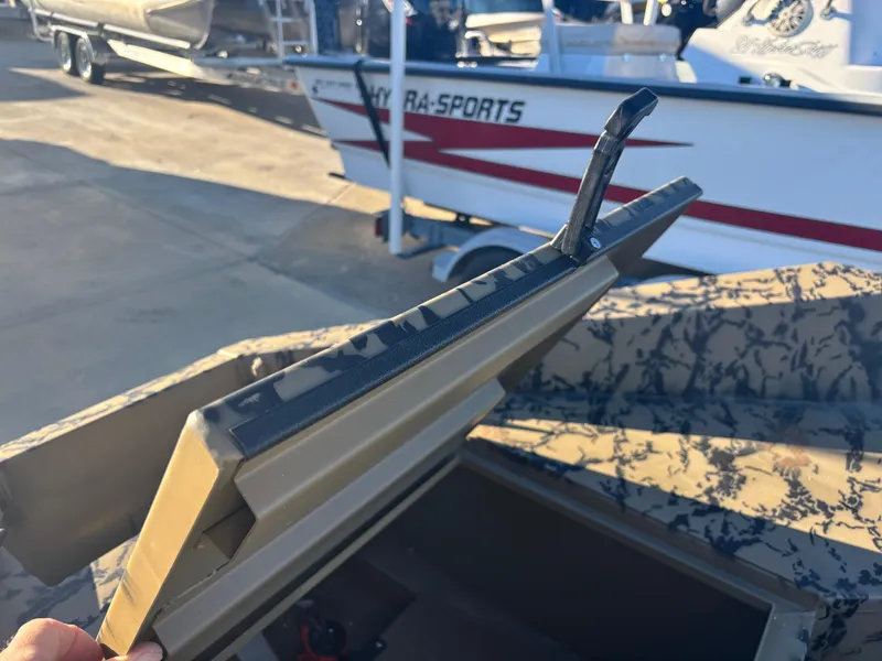 Slide: The Image of Edge Duck Boats 556 DB 2025 model with camo pattern and storage compartment. - 5