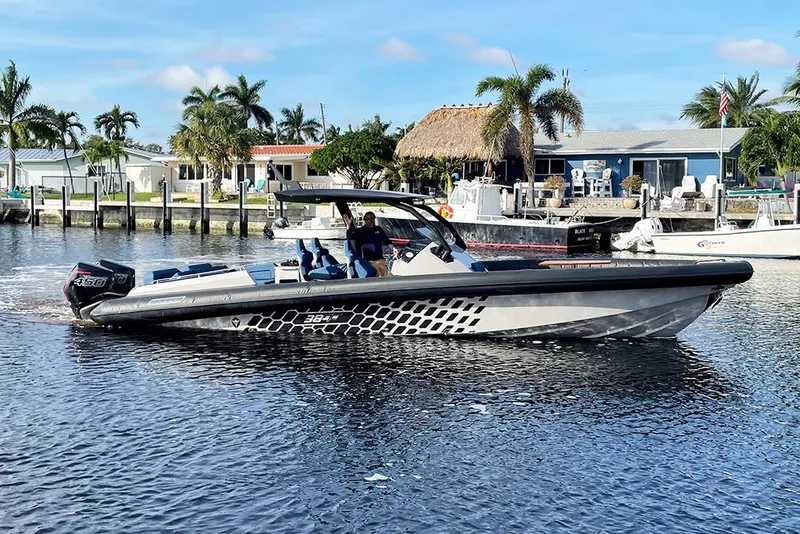 Slide: The Image of 2023 Skipper-BSK 38NC boat cruising on a sunny day in a marina. - 1
