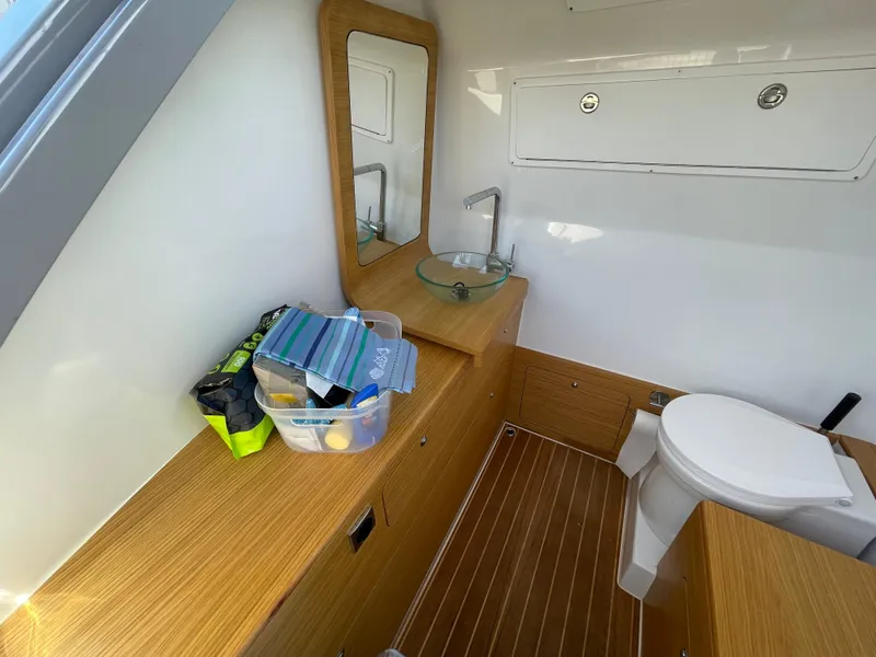 Slide: The Image of Modern Skipper-BSK 38NC 2023 boat bathroom with wood accents and compact design. - 27