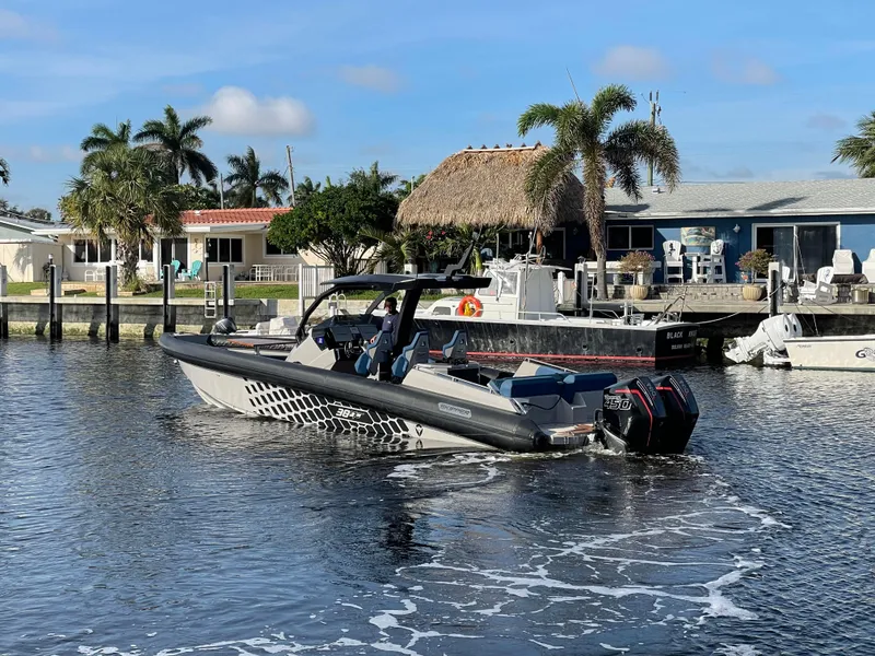 Slide: The Image of 2023 Skipper-BSK 38NC boat docked in a sunny waterfront setting. - 5