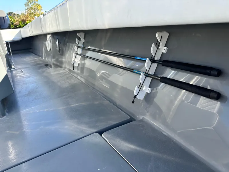 Slide: The Image of 2005 Contender 36 Open boat interior with fishing rod holders. - 15