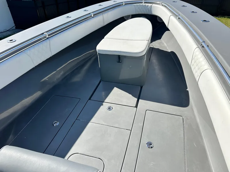 Slide: The Image of 2005 Contender 36 Open boat interior with seating and storage compartments. - 18