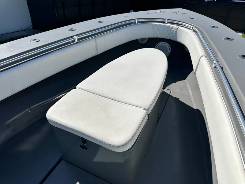 Slide: The Image of 2005 Contender 36 Open boat interior with cushioned seating and storage. - 19