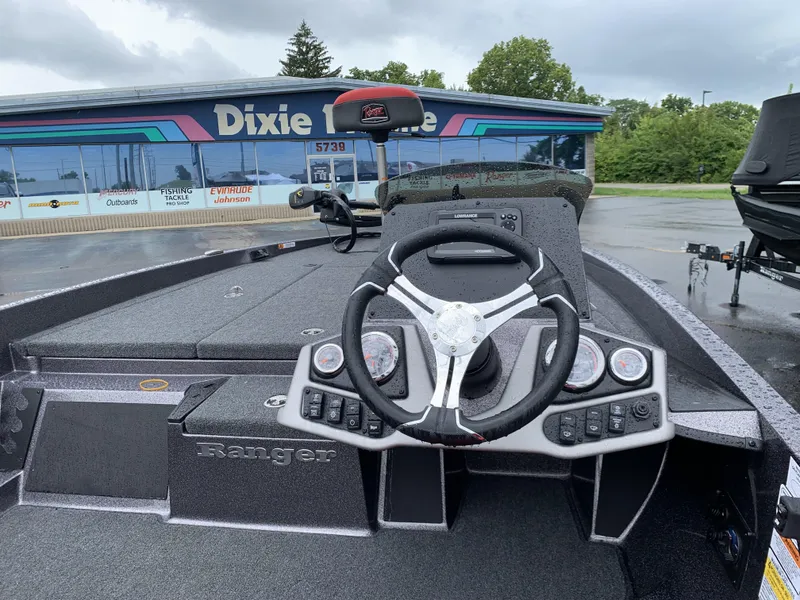 Slide: The Image of 2025 Ranger Z185 boat interior with steering wheel, dashboard, and electronics at Dixie Marine. - 4