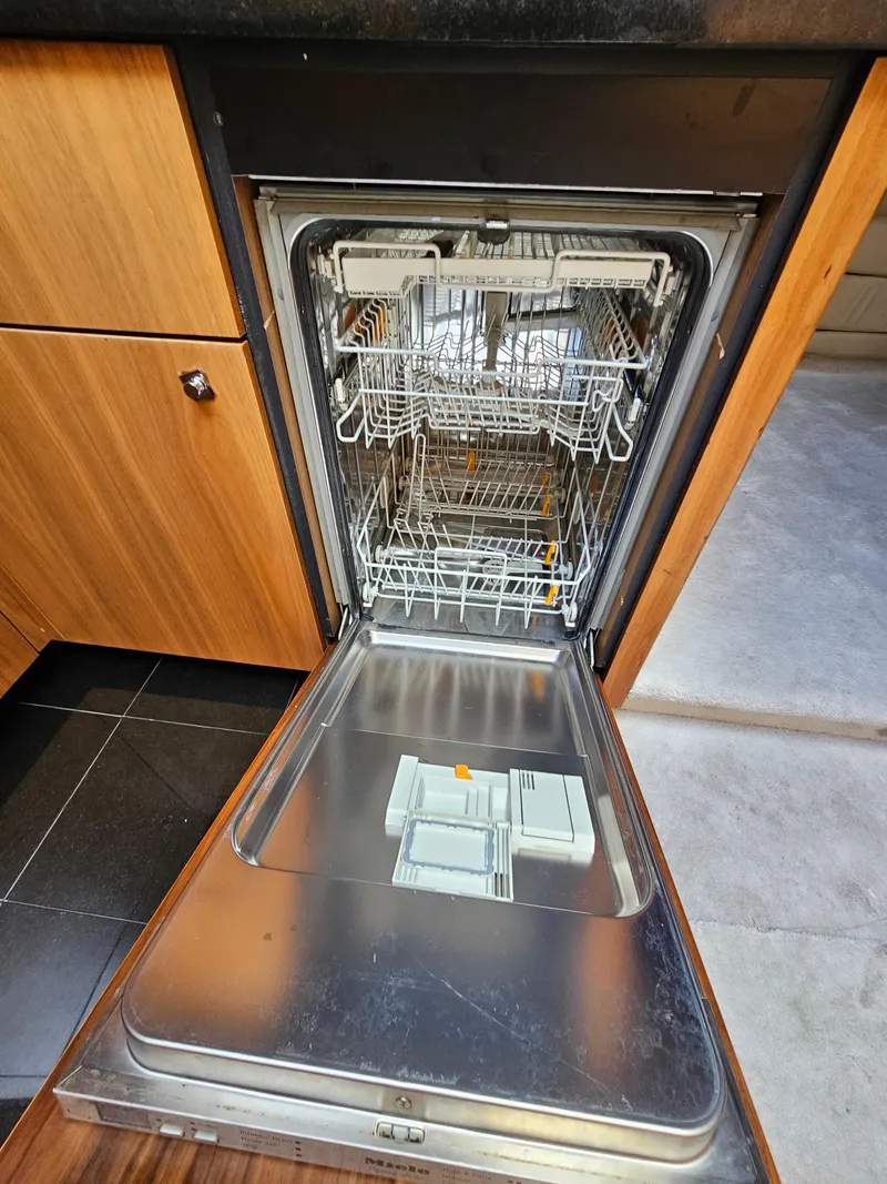 Slide: The Image of Open dishwasher in Sunseeker Predator 64 yacht kitchen, 2010 model. - 10