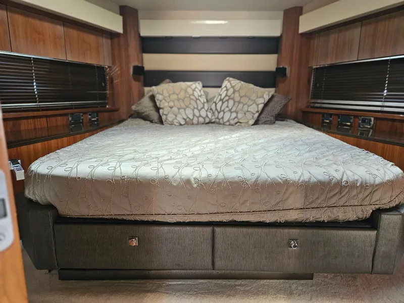 Slide: The Image of Luxurious bedroom interior of 2010 Sunseeker Predator 64 yacht with elegant bedding. - 14