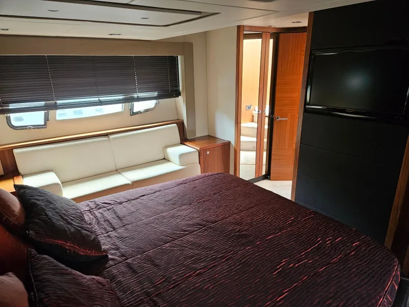 Slide: The Image of Luxurious interior of 2010 Sunseeker Predator 64 yacht with bed, sofa, and TV. - 17