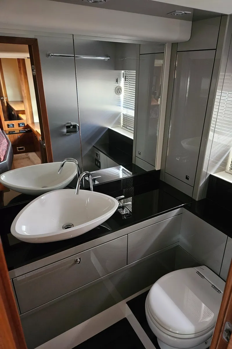 Slide: The Image of Luxurious bathroom in 2010 Sunseeker Predator 64 yacht with modern fixtures. - 19