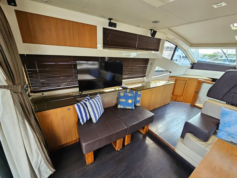 Slide: The Image of Luxurious interior of 2010 Sunseeker Predator 64 yacht with modern seating and TV. - 5