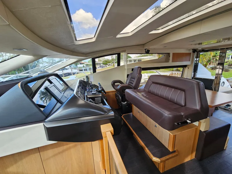 Slide: The Image of Interior of 2010 Sunseeker Predator 64 yacht with modern helm and seating. - 6